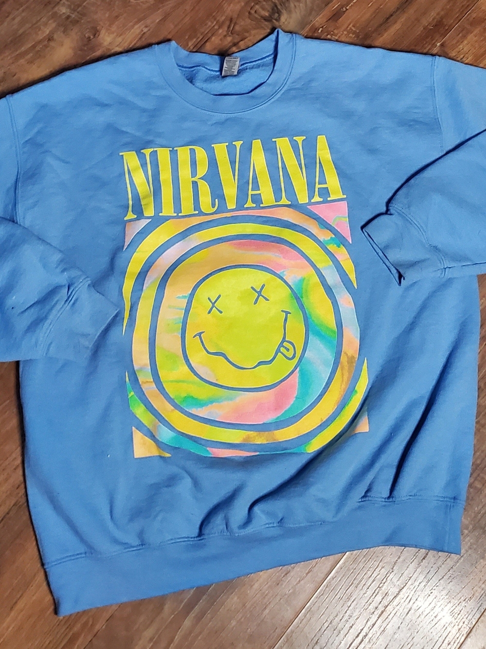 NIRVANA Light Blue Crewneck Sweatshirt with Neon Smiley Graphic